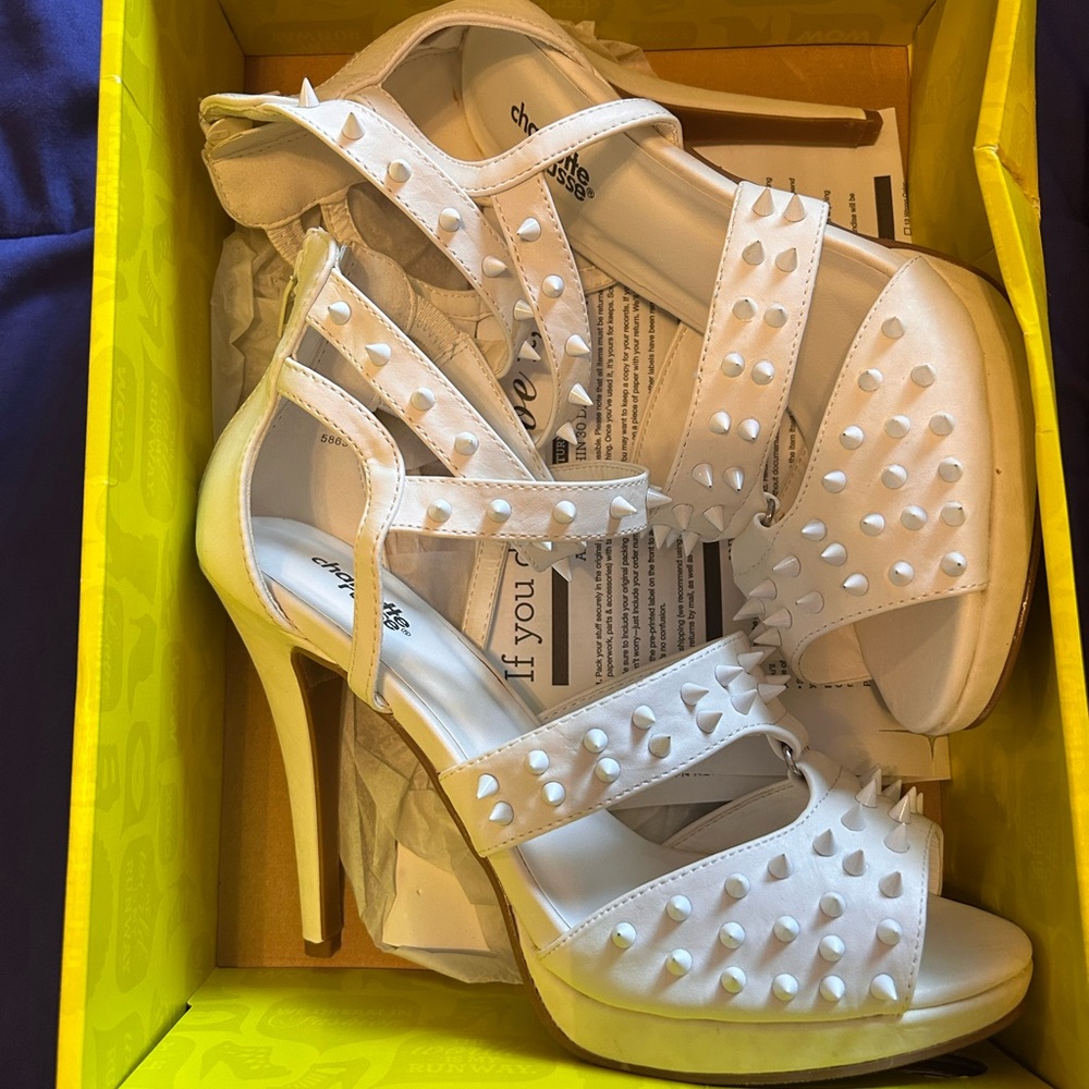 White Charlotte Russe heels. New in box. Zipper on back.